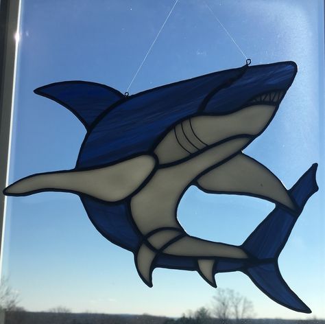 Shark 1 stained glass sun catcher. $60. AVAILABLE Shark Stained Glass Art, Stained Glass Shark Pattern, Shark Stained Glass Patterns, Stained Glass Shark, Stained Glass Simple, Glass Shark, Diy Stained Glass Window, Stained Glass Sun, Stained Glass Patterns Free