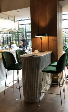 Bar Seating Design, Stone Bar Table, Standing Table Design, Column Seating, Communal Table Restaurant, Bar Banquette, Bar Area Design, Columns Design, Brick Cafe