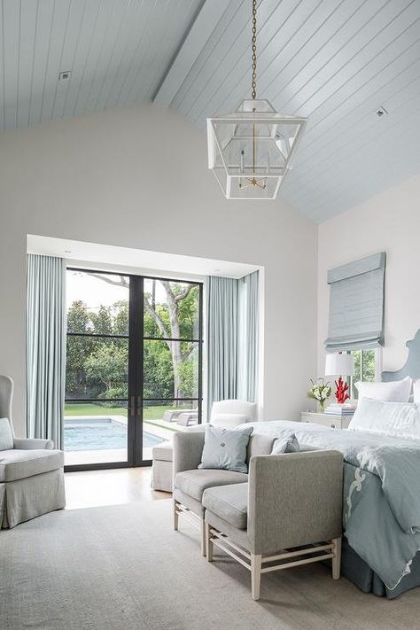 This spacious master bedroom is complete with white and blue monogrammed bedding, comfortable gray settee, and gray nightstands. Blue Ceiling Bedroom, Lattice Headboard, Grey Grasscloth Wallpaper, Vaulted Ceiling Bedroom, Girls Blue Bedroom, Groove Ceiling, Blue Boys Bedroom, Grey Painted Walls, Blue Gray Bedroom