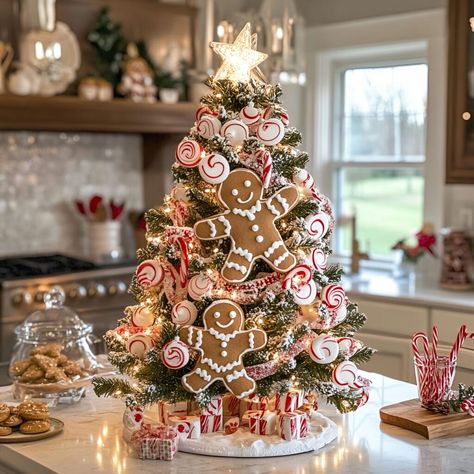 Gingerbread ornaments combined with candy canes make this Christmas tree a delightful centerpiece. Twinkling lights and baked goods elevate the festive appeal. Gingerbread Table Centerpieces, Gingerbread Centerpiece Ideas, Gingerbread House Christmas Tree, Gingerbread Centerpiece, Whimsical Christmas Trees, Kitchen Ornaments, Candy Cane Christmas Tree, Traditional Holiday Decor, Gingerbread Ornaments