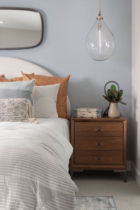 Contemporary Feng Shui bedroom with neutral design accents. Cozy Simple Bedroom, Blue Room Accents, Primary Bedroom Decor, Modern Primary Bedroom, Bedside Tables Modern, Primary Bedroom Design, Bedroom Nightstand Decor, Modern Cozy Bedroom, Light Blue Bedroom