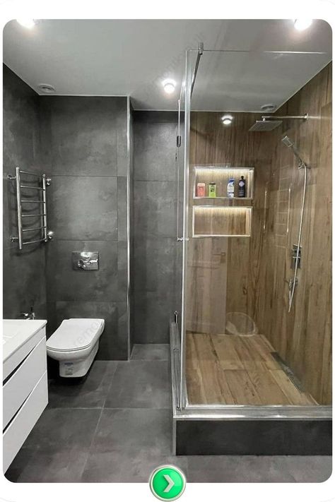 Spa-inspired bathroom with dark grey tiles, wooden shower floors, recessed shelves, and glass partitions for a calming, natural retreat feel. Grey Bathroom Tile, Dark Grey Bathroom, Dark Grey Tile, Dark Gray Bathroom, Colorful Bathroom Tile, Recessed Shelves, Grey Bathroom Tiles, Spa Inspired Bathroom, Grey Bathroom