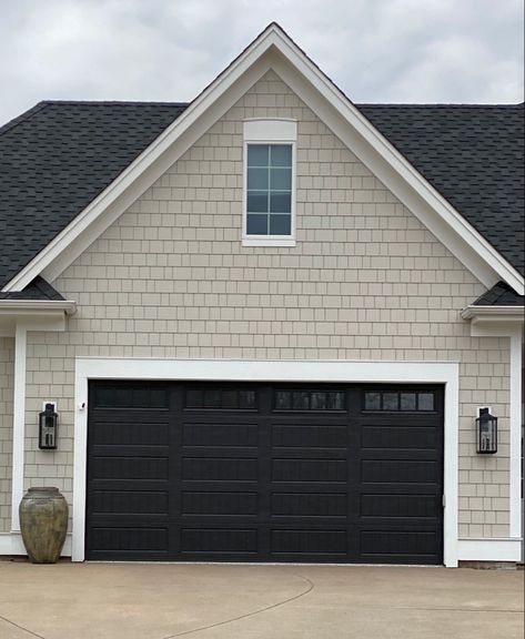 Black Garage Doors Beige House, Modern Front Of House Ideas, House With Black Garage Doors, Houses With Black Garage Doors, Remodel Outside Of House, Garage Door Ideas Curb Appeal, Garage Doors Black, Trim Exterior House, Black Trim Exterior