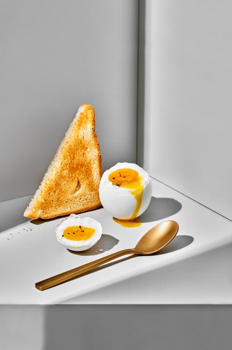 Toast, egg, and runny yolk ready for breakfast in a surreal composition with a golden spoon. © Copyright Suzanne Clements. All rights reserved. #abstract #food #photography #breakfast #softboiled #egg #soft boiled #brunch #runny yolk #yolk Breakfast Minimal, Minimal Breakfast, Abstract Food Photography, Egg Photography, Macro Food Photography, Honey Breakfast, Breakfast Photography, Egg Photo, Food Art Photography