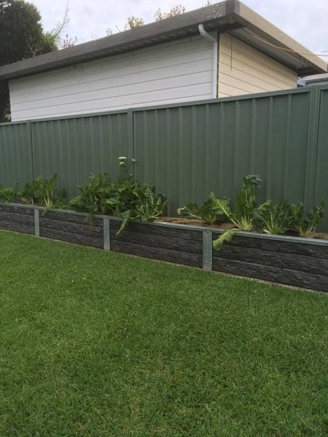 Ridgi Rocks concrete sleeper & steel post garden bed. For more information visit ridgi.com.au or bunnings.com.au Sleeper Garden Beds, Concrete Sleeper Garden Bed, Garden Bed Retaining Wall, Privacy Backyard, Concrete Sleeper Retaining Walls, Backyard Rock Garden, Beach House Landscaping, Sleepers In Garden, Concrete Sleepers