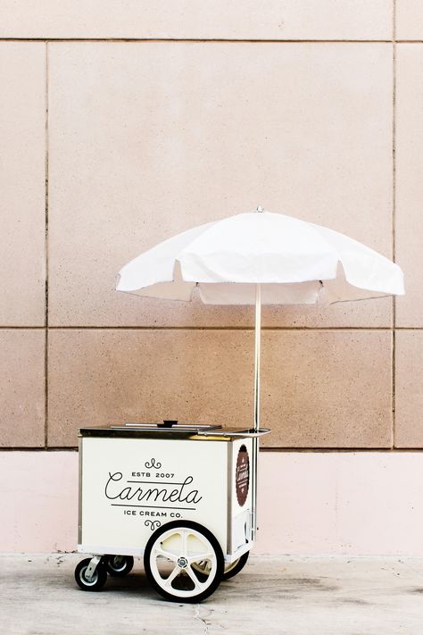 Carmela Ice Cream operates this umbrellaed push cart in Pasadena, California, as well as a larger ice cream truck and three retail locations in the great Los Angeles area. Their custard-style bases and fresh, seasonal ingredients result in delicious flavors like candied pecan, rosemary with toasted pine nuts, lemon verbena vanilla bean. They've got sorbets and sherbets, too. Prosecco Van, Gerobak Dorong, Food Truck Wedding, Pizza Truck, Mobile Bars, Ice Cream Stand, Push Cart, Mobile Food Trucks, Food Cart Design