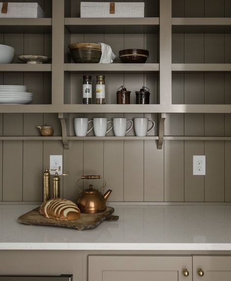 Pantry detail from @caliberhomes. Nickel gap paneling runs vertically from counter-top through the open shelving. A decorative wooden bracket holds up a shallow shelf for coffee mug display. #pantrydesignswelove #pantry #pantryideas #kitchendetails #homeinspo #homeinspiration #pantryinspiration #coffeemugdisplay #coffeebar Small Butlers Pantry, Shallow Shelf, Shallow Pantry, Nickel Gap, Wooden Shelves Kitchen, Shallow Shelves, Pantry Inspiration, Coffee Mug Display, Georgia House