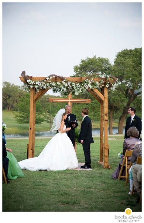 Love the cross in the background. floral arch Outdoor Wedding Backdrops, Wedding Arches Outdoors, Cross Wedding, Diy Wedding Arch, Wedding Alters, Wedding Arbor, Backyard Weddings, Wedding Backdrops, Diy Wedding Backdrop