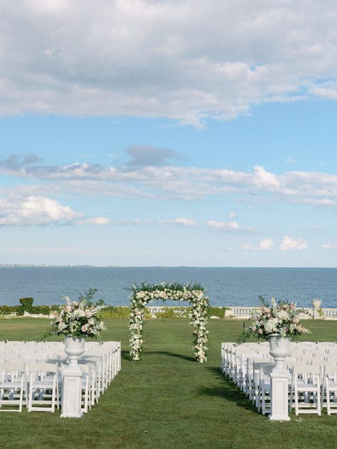 Outdoor ceremony at Rosecliff Newport Mansion with floral arbor and ocean views. Photography By Halie | Boston and New England Rosecliff Mansion Wedding Ceremony, Wedding Venue New England, Ocean House Wedding, New England Wedding Aesthetic, Mansion Outdoor, East Coast Old Money, Wedding Hamptons, Rosecliff Mansion Wedding, Floral Arbor