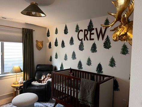 It's giving woodland, whiskey room vibes. We love everything about this nursery! 🌲⁠ ⁠ 📸: @clord946 Baby Boy Nursery Ideas, Boy Nursery Ideas, Whiskey Room, Room Vibes, Woodland Nursery Theme, Glider Rocker, Tree Decals, Pretty Wreath, Baby Boy Nursery