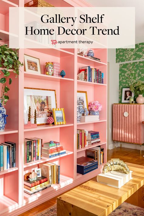 Meet the gallery shelf, which mixes gallery wall art with shelf-like perches perfect for books, 3D objects, and more. Maximalist Bookshelf Styling, Coral Bookshelf, Colourful Shelves, Colourful Bookshelf, Eclectic Shelf Decor, Dopamine Interior, Listening Lounge, Pink Bookshelves, Homey Touches