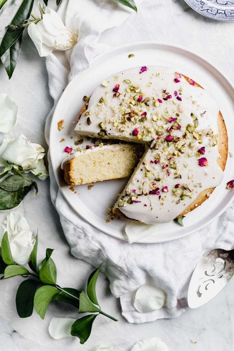 Persian Love Cake: a fragrant rose cake flavored with freshly ground cardamom and almond flour, and topped with crushed pistachios and rose petals. Persian Love Cake Recipe, Petal Cupcakes, Persian Love Cake, Crushed Pistachios, Cardamom Recipe, Water Birthday, Cake Rose, Pistachio Dessert, Broma Bakery