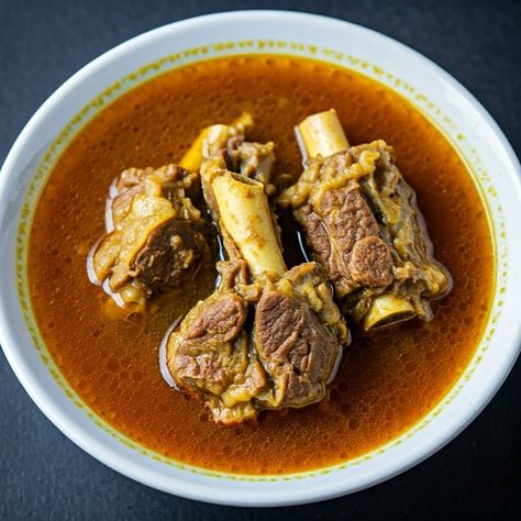 Mutton Paya Soup is a traditional, flavorful South Indian delicacy that combines tender mutton trotters with aromatic spices and a comforting broth. This rich and hearty soup is slow-cooke...  #aromaticIndiandishes #comfortingsoup #familydinnerideas #heartymeal #homemadesoup #muttonpayasoup #muttonrecipes #muttontrotters #nutrientrichsoup #slowcookedrecipes #soulwarmingsoup #spicymuttonsoup #traditionalIndiancuisine #traditionalsouthIndianrecipe #warmingcomfortfood #Appetizer #Lamb #Mutton #Soup Mutton Raan Recipe, Mutton Paya Recipe, Paya Soup, Mutton Paya, Mutton Soup, Paya Recipe, Goat Recipes, Mutton Recipes, Using A Pressure Cooker