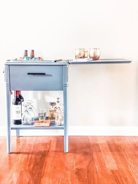 Do you have an old sewing machine in the attic or basement?If you do, see how you can create a functional and cute bar cart upcycle. It was time to move this from the garage. After my mom passed, I had the task of going through her home and divvying up her belongings.An overwhelming task as anyone that has done it can attest. I’ve read recently that no one wants their parents things, it was different for my family.Since then I’ve hosted workshops on turning treasures you don’t want f… Sewing Cabinet Makeover, Cute Bar Cart, Sewing Table Repurpose, Kitchen Sink Remodel, Old Sewing Machine, Sewing Machine Cabinet, Basement Furniture, Sewing Machine Table, Sewing Cabinet