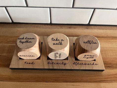 Never struggle to decide what to do for a date night again! Details: Dice are 1 1/2" in size Includes a stand for all 3 dice Date Night Dice Diy, Wooden Dice Crafts, Wedding Gifts Ideas For Couple, Anniversary Crafts For Him, Wooden Anniversary Gifts For Him, Date Night Gift Ideas, Laser Wood Projects, Date Gift Ideas, Holiday Wood Signs