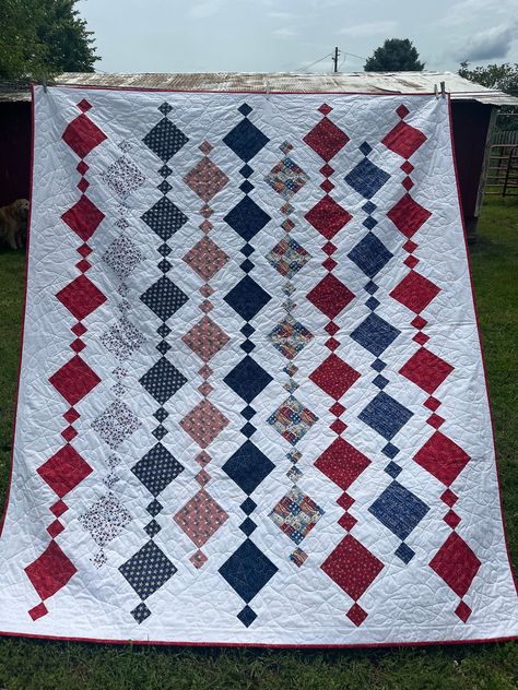 Red, white and blue patriotic Fourth of July quilt made with all new, 100% cotton on front and back of quilt. pattern is called Chandelier Pattern. Quilting is done in house on a longarm machine with a patriotic Stars and Stripes pattern. Made in a smoke-free home. Bedding is final sale. I am happy to send additional pictures or any questions you may have. Made in Seneca, Missouri. Fourth Of July Quilt, Chandelier Quilts, Patriotic Quilts Patterns Free, Quilts Of Valor, American Quilts Patterns, Striped Quilt, Red And White Quilts, Patriotic Stars, Country Quilts