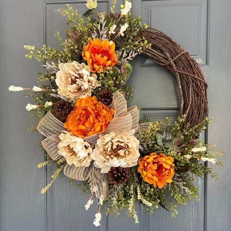 This wreath is Handmade with premium, artificial fall leaves, artificial beige and golden peonies, berries, accompanied with a burlap bow on a grapevine wreath base. The perfect front door or wall decoration. No two are alike, but always created with the same amount of material and the same attention to detail, to create a one-of-a-kind masterpiece for you.  IMPORTANT  ATTENTION: I spray each wreath with Protective Clear Finish, but please be aware that wreaths placed outdoors WILL weather or de Cute Halloween Wreaths, Olive Green Fall Decor, Fall Wreath For Front Door, Reefs For Doors, Fall Reefs For Doors Diy, Fall Floral Wreath, Simple Fall Wreath, Modern Fall Wreaths For Front Door, Fall Door Wreaths Diy