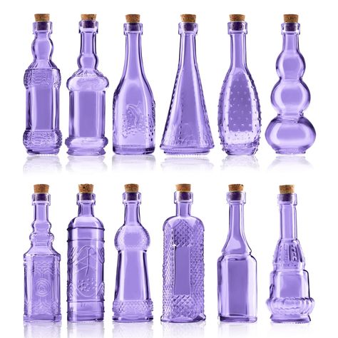 BULK PARADISE Small Mini Purple Vintage Glass Bottles with Corks, Mini Vases, Decorative Glass Bottle, Potion Bottles, Assorted Design Set of 12 pcs, 4.6 Inch Tall (11.43cm), 1.4 Inch Wide (3.56cm) Perfect Accessory for your Home Decor: 12 Pcs Glass Bottles. Bottle mouth diameter: 0.45 inch (1.14cm), bottle height(Without Cork): 4.6 inch (11.43cm), bottom diameter: 1.4 inch (3.56cm). Beautiful Assortment of Shape and Styles: Each bottle is uniquely designed. Giving you a beautiful assortment of shapes and styles, reminiscent of antique apothecary bottles and kitchen spice jars. . Made of high quality antique styled glass. Very sturdy and hard to break. Last long time 101 Use In Homes: Small bud vases, sand holder, message bottles, wedding favors, medicine jars, mini treasures holder, table Lotus Witchcraft, Orchid Room, Vaporwave Room, Home Foundation, Witchcraft Tools, Water Inspiration, Bottle Shapes, Witchy Kitchen, Vintage Glass Bottles