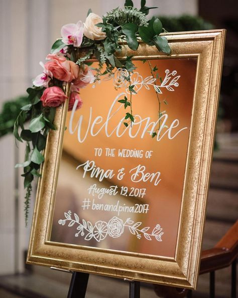 Welcome sign - thick gold frame mirror with calligraphy writing in white and greenery Garland either along the top border of the frame or at the bottom base border of the frame with white color peonies or roses only as flowers Happy 2 Year Anniversary, Gold Frame Mirror, Mirror Wedding Signs, Mirror Writing, Mirror With Flowers, Wedding Sign Decor, Wedding Borders, Roses Only, Wedding Mirror