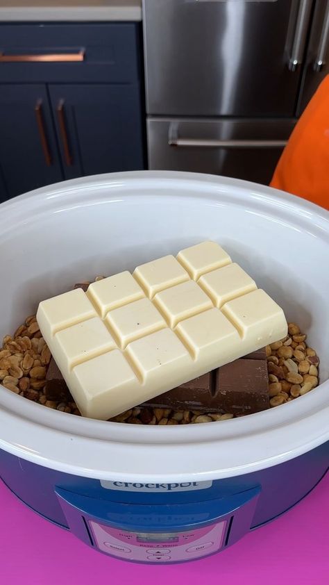 Crockpot candy trick | Crockpot Candy trick Elaine makes delcious candy in the crockpot using peanuts, almond bark and chocolates. This video was produced by Network Media,... | By My Life | Alright, that's just two jars of my planters, dry roasted, lightly salted peanuts, and now I'm just going to flatten these out. Make a flat surface. Okay. Now I have one bar of my milk chocolate almond bark. This is set this right on top. And now I have one bar of my vanilla almond bark, vanilla chocolate. Peanut Butter Crockpot Candy, Crockpot Candy With Peanut Butter, Crockpot Chocolate Peanut Clusters, Almond Bark Candy, Chocolate Chips And Peanut Butter, Crock Pot Candy, Peanut Clusters In Crockpot, Butter Soup, Crockpot Candy Recipes