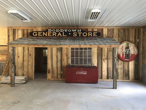 Store front in man cave Shop Loft Ideas Man Cave, Man Cave In Shop, Man Cave Garage Rustic, Pole Barn Man Cave Ideas, Rustic Garage Ideas, Western General Store Ideas, Party Barn Ideas, Garage Bar Ideas Man Caves, Barndo Man Cave