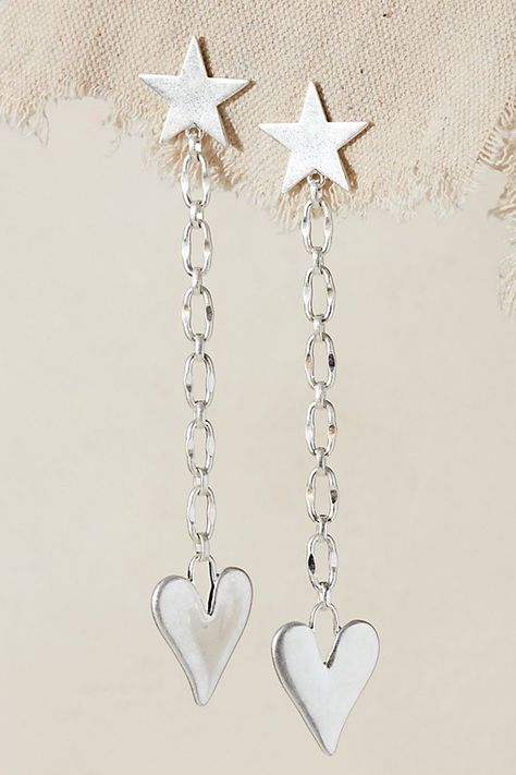 Shine bright with these dangly star-studded earrings, featuring a funky chain adorned with lovely heart pendants. **Features:** Dangle drop design, star studs, wavy link chain, heart charms, for pierced ears **Why We ❤ It:** Add this statement pair to your casual and formal ‘fits. | Alia Dangle Earrings by Free People in Silver Studded Earrings, Chain Heart, Heart Pendants, Drop Design, Dangly Earrings, Star Studs, Accessories Jewelry Earrings, Drops Design, Pierced Ears