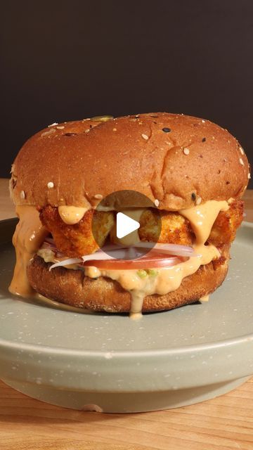 408K views · 22K likes | Vegan Scratch Kitchen on Instagram: "🔥 TOFU CHIK’N SANDWICH 🔥

It’s been over a month since I posted my last stop motion video, so I knew I had to make it happen for y’all. This crispy tofu chik’n sandwich is💥BOMB💥 my friends. I actually posted a full recipe video for it back in July of last year, so if you’re interested in seeing the full process, you can check out that reel 👍🏼 

For this stop motion, I wanted to bring back the “magic knife” chopping (since everyone loves it) but also showcase a “never-before-seen” element. I was sitting in bed the other night and thought to myself, “What if you showed a recipe coming together on a spinning plate?” I had a vision for the spinning motion but knew the process of making it happen would be challenging. But, in t Vegan Chicken, Firm Tofu, Plant Based Cookbook, Vegan Mayo, Special Sauce, Crispy Tofu, Iceberg Lettuce, Extra Firm Tofu, Vegan Sandwich