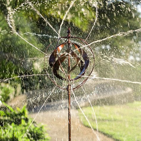 Combines a bronze metal sculptural wind spinner with a water sprinkler to create kinetic yard art that also waters a lawn, garden, or flower beds in a much more interesting way. Faux Greenery Outdoor, Wind Charms, Wind Spinners Diy, Outdoor Privacy Panels, New Business Plan, Kinetic Wind Spinners, Decorative Fountains, Spinners Diy, Invincible Summer