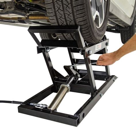 This set of two Black Widow Hydraulic Car Lifts with Ramps is designed for professional or home garage use as an alternative to jacking up your vehicle and setting it on jack stands. The ramped design allows you to drive up and onto the lift platform, and a foot pedal raises the lift hydraulically from 5" to 15". Sold as a pair, this car lift provides ample access for oil changes, underbody work and simple repairs, and supports up to 3,000 lbs. Truck Shop Garage, Diy Car Ramps, Home Car Lift, Car Lifter, Hydraulic Car Ramps, Portable Car Lift, Car Hoist, Hydraulic Car Lift, Garage Car Lift