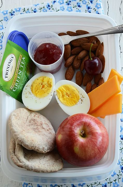 1 Hard-Boiled Egg; 3 Small Slices Cheese (about 3/4 oz); 1 Handful Unsalted Almonds (about 1 1/2 oz):  I also like walnuts, cashews, and sunflower seeds; 1 Apple:  Any piece of whole fruit will do; 2 Mini Whole Wheat Pitas:  Any healthy carb is perfect; 1 Tablespoon All-Fruit Jam:  This is optional – just for spreading on your bread; Green Tea; 1 Cherry Menu Sarapan Sehat, Healthy Breakfast On The Go, Breakfast Low Carb, Healthy Breakfasts, Breakfast On The Go, Health Breakfast, Health Snacks, High Protein Recipes, Food Items