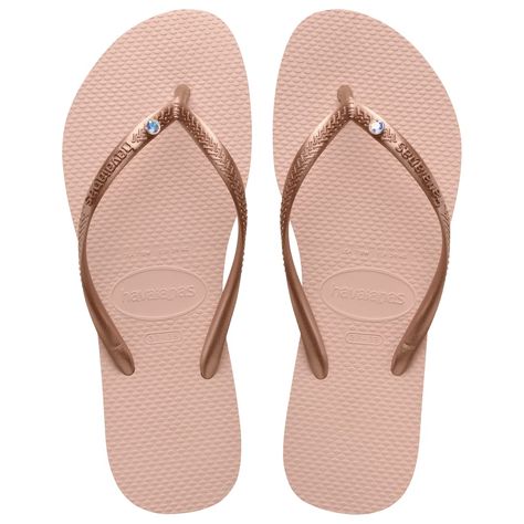 PRICES MAY VARY. Slim Flip Flops for Women: These summer sandals have authentic Swarovski crystal embellishment on a slim metallic strap Comfortable Sandals: Features cushioned footbed with textured rice pattern and rubber flip flop sole Durable and Versatile: Lightweight, waterproof sandals for women with slip-resistant rubber sole, available in a wide range of colors Rubber Sandal Construction: The marshmallow-soft yet highly durable slim flip flops will last all summer long Havaianas Flip Flo Women Summer Sandals, Waterproof Sandals, Cute Flip Flops, Flip Flops For Women, Rubber Flip Flops, Havaianas Flip Flops, Crystal Sandals, Rubber Sandals, Disney Shop