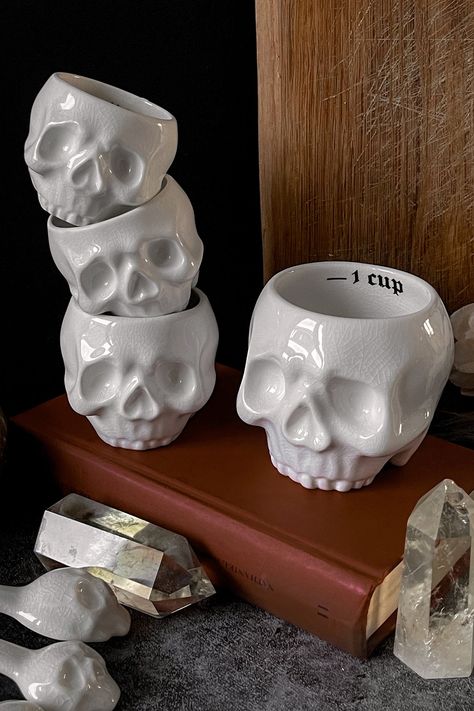 CRANIUM.- Statement ceramic measuring cups.- Glossy crackle effect finish.- Contains set of 4 measuring cups.- Measurements are for 1/3 cup, 1/4 cup, 1/2 cup and 1 cup.With KILLSTAR branding, 100% Ceramic. Hand wash only / Wash before use / Do not microwave / Approximate Capacities. Imported. Goth Office Accessories, Addams Family Cup, West Elm Skull, Goth Accessories Home, Goth Kitchen, Gas Monkey Garage, Dark Home Decor, Cerámica Ideas, Goth Home