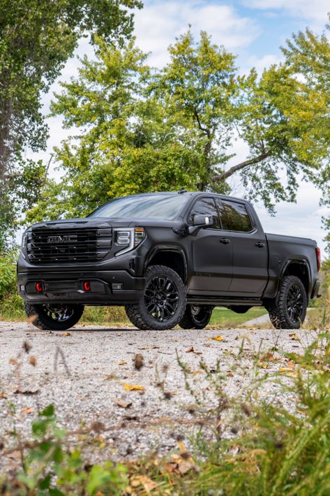 Full view of a 2024 GMC Sierra Denali truck with chrome delete trim, a satin black vinyl wrap, and a lift kit. Gmc Sierra Blacked Out, Custom Gmc Sierra 1500, Gmc Sierra Denali Lifted, Black Gmc Truck, Lifted Gmc Sierra 1500, Gmc Sierra Lifted, Gmc Truck Accessories, Gmc Denali Truck, Gmc Car