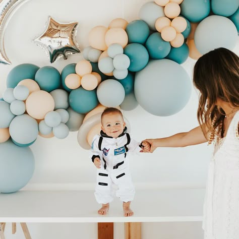 Sydney Aylesworth on Instagram: “BECKHAMS FIRST TRIP AROUND THE SUN!🌙🪐⭐️🚀 celebrated our little one year old astronaut today! thank you to everyone who came today, this…” Space Themed Birthday Party One Year Old, Two Year Old Space Party, Space One Year Old Party, First Trip Around The Sun Boy, One Year Around The Sun Birthday Boy, One Year Old Space Birthday, First Trip Around The Sun Birthday Backdrop, First Trip Around The Sun Birthday Party Backdrop, 1st Year Birthday Party Ideas Boy