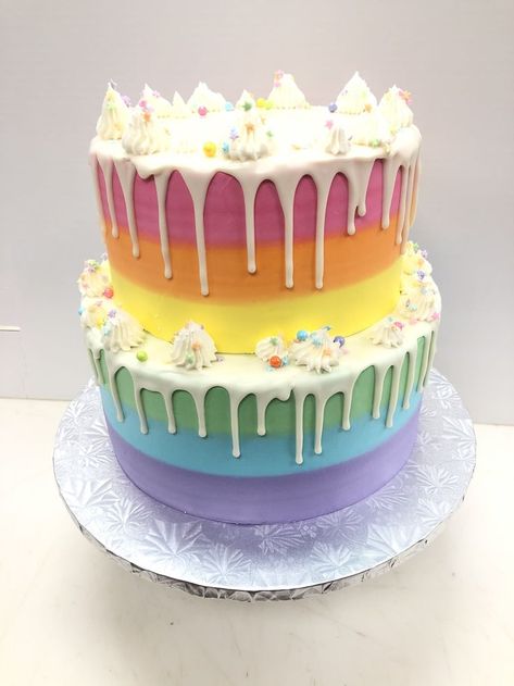 2 tier buttercreasm rainbow ombre with white chocolate ganache drip with decorations in buttercream and sprinkles Rainbow Tiered Cake, 2 Tier Rainbow Cake, Rainbow Two Tier Cake, White Chocolate Cake Decoration, Georgia Cake, Ombré Cakes, White Chocolate Ganache Drip, Rainbow Drip Cake, Rainbow Sprinkle Cakes