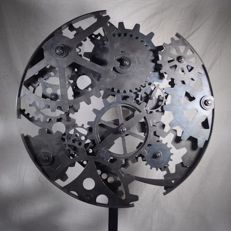 Steel cog sculpture by @jordanbrittsculpture #sculpture #metalwork #metalsculpture #cogs #steelsculpture #metalart #cogart #weldporn #weldingart #weldart #artcollective #artistoninstagram #craftagram #instacraft #craftwork #craftsman #crafty #craftart #metalcraft #unknown #embracetheunknown #theunknownemporium #tue Suspended Art, Light Shield, Skeleton Clock, Industrial Steampunk, Steampunk Gears, Mixed Media Sculpture, Steel Sculpture, Wall Sculpture Art, Metal Sculpture