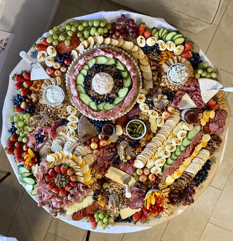 Created this table for my family on Thanksgiving. It was a hit!  #charcuterie #grazingtables #cheeseboard Round Grazing Table Wedding, Charcuterie On Round Table, Charcuterie Round Table, Round Table Charcuterie Display, Round Charcuterie Table, Charcuterie Board For 100 People Wedding, Large Circle Charcuterie Board, Flat Lay Grazing Table, Giant Grazing Table