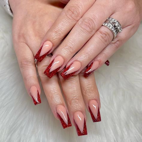 French manicures have been a staple for many years, and now it's time to shake it up with red French tip nails! French tip nails | French nail designs | Red nails | Red french tips | Nail design ideas | Simple nail design ideas | 2023 nail trends | Red Acrylic nails | Red Coffin Nails | Short red nails Red Sparkle French Tip Nails, Sparkly Red French Tip Nails, Red Glitter French Tip Nails, Red Glitter Nail Polish, Red French Tip Nails, Red French Tips, Red French Manicure, Ruby Nails, Short Red Nails