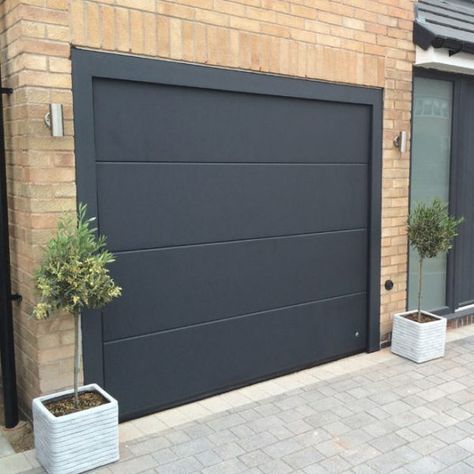 Black Garage Door, Metal Garage Doors, Black Garage, Sectional Garage Doors, Modern Garage Doors, Garage Door Types, Garage Door Styles, Welcome Signs Front Door, Wood Garage Doors