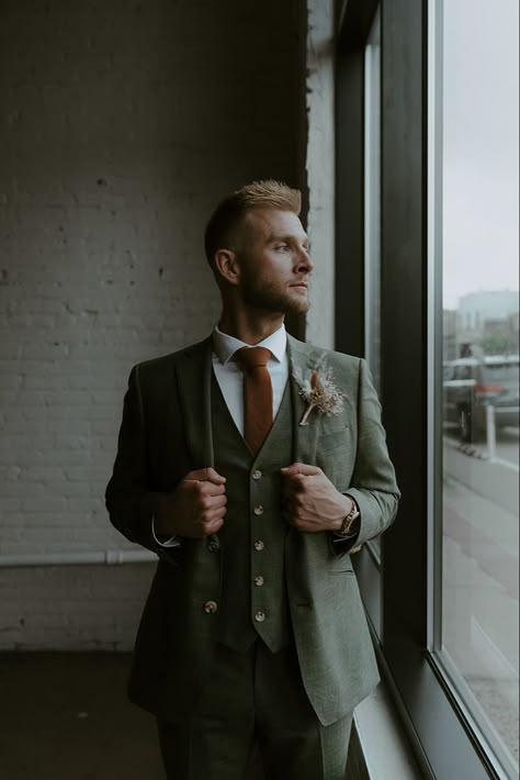 Brown And Green Suit Wedding, Green Suit Terracotta Tie, Green And Burgundy Groomsmen Attire, Indochino Suit Wedding, Green Suit Orange Tie, Earthy Suits For Men, Dark Green Tweed Wedding Suit, Green Suit Brown Tie, Groom Dark Green Suit