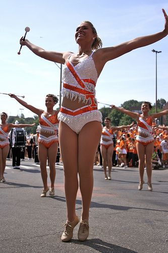 former Tennesse feature twirler adria farr with the rest of the Tennessee majorettes Majorette Dance Uniforms, Majorette Costumes, Baton Twirling Costumes, Majorette Uniforms, Twirl Girl, Twirling Costumes, Tennessee Volunteers Football, Carnival Girl, Dance Uniforms