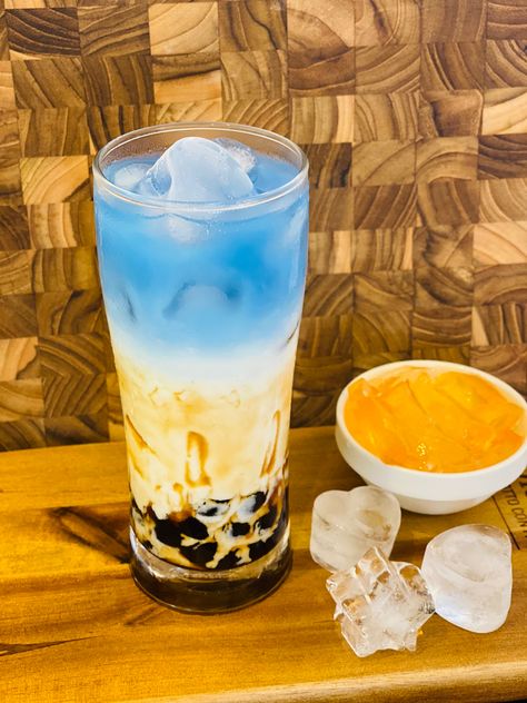 Butterfly pea flower milk tea Butterfly Pea Flower, Butterfly Pea, Pea Flower, Milk Tea, Pint Glass, Pillar Candles, Beer Glasses, Blue Sky, Milk