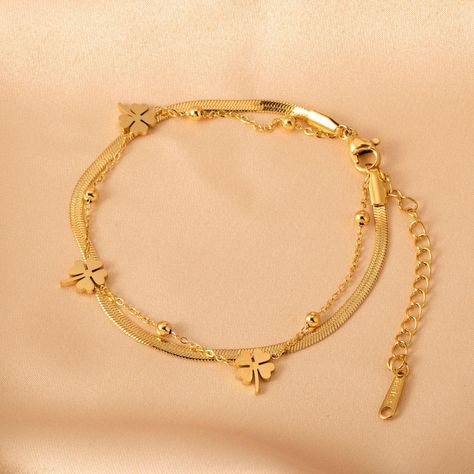 Product name: Non-fading double layer Four-leaf clover flat snake bone bracelet Material: Titanium steel Size: chain length 180+50mm Packaging: gift box Color: gold Product weight: 3.43g Remarks Statement: We use vacuum furnace electroplating for color plating, and the material is also selected 316 titanium steel, no discoloration, no rust, no allergy, no black, wear-resistant, green and environmental protection Gold Design Bracelet, Double Chain Bracelet Gold, Gold Leaf Bracelet, Breslet Jewelry Gold, Gold Breslet, Bracelet Ideas Gold, Gold Bracelet Design, Real Gold Bracelet, Bone Bracelet