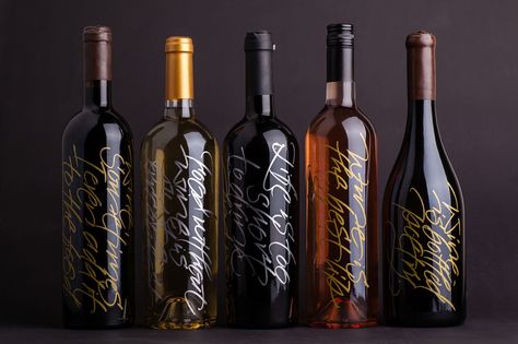 Unique creative project combining wine bottle packaging and calligraphy, with each bottle bearing a unique handwritten inscription. Wine Bottle Engraving, Wine Bottle Design Label, Engraved Wine Bottles Wedding, Wine Label Typography, Engraved Wine Bottles, Wine Bottle Packaging, Wine Bottle Label Design, Premium Wine Label Design, Bottle Label Design