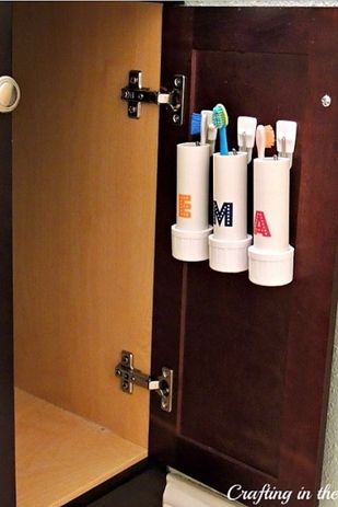 Use Command strips to attach storage pods or PVC pipes to the inside of a bathroom cabinet. | 44 Cheap And Easy Ways To Organize Your RV/Camper Tiny Living Space, Camper Organization, Rv Organization, Camper Storage, Toothbrush Holders, Sikat Gigi, Rv Storage, Camping Checklist, Boys Bathroom