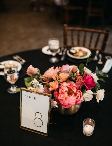 Black Wedding Table Linens, Black And Pink Wedding Centerpieces, Black Tablecloth Bright Flowers, Black Tablecloth Pink Flowers, Black And White Wedding With Colored Flowers, Black Table Cloth Colorful Flowers, Black Tablecloth Colorful Flowers, Pink Orange And Black Wedding, Black Orange Pink Wedding