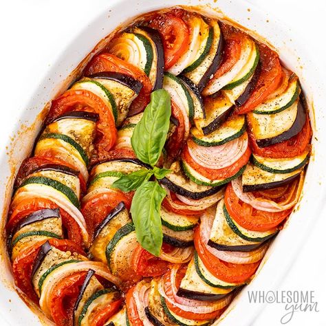 The Best Easy Baked Ratatouille Recipe | Wholesome Yum Baked Ratatouille Recipe, Ratatouille Dish, Baked Ratatouille, How To Make Ratatouille, Vegetarian Christmas Dinner, Easy Ratatouille Recipes, Vine Tomatoes, Ratatouille Recipe, Vegetarian Christmas