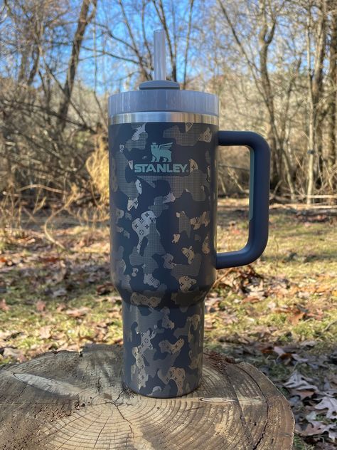 40 oz Stanley laser engraved with our Fancy Laser Camo Design Inventory of colors changes constantly, if you are looking for a certain color please feel free to message me! This tumbler is brand new, 360o laser engraved with handle and straw lid. The pattern is virtually seamless. All sales are final. We are not responsible for mail marked DELIVERED by carrier. Please make sure you are having your packaged delivered to a secure area. Camo Stanley Cup, Yeti Cup Designs, Camo Tumbler, Trendy Water Bottles, Engraved Tumblers, Cute Cowgirl Outfits, Casual Country Outfits, Cowgirl Accessories, Cute Coffee Cups