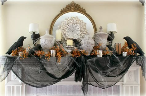 Crows, old book pages, and a healthy dose of black gauze up the spooky factor of this elegant fireplace. Halloween Mantel Decor, Halloween Chic, Halloween Fireplace, Vintage Market Days, Halloween Mantle, Hallowen Ideas, Dark Decor, Halloween Mantel, Chic Halloween