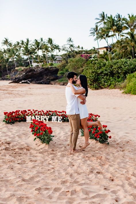 This beach wedding proposal was filled with tons of red roses and a "Marry Me" marquee sign. Nothing like a romantic wedding proposal on the beaches of Maui. Looking for more wedding proposal ideas? Check out our website! Marry Me Signs Proposal, Proposal Ideas Romantic, Proposal Flowers, Beach Proposals, Proposal Setup, Romantic Ways To Propose, Wedding Proposal Ideas, Proposal Locations, Proposal Inspiration